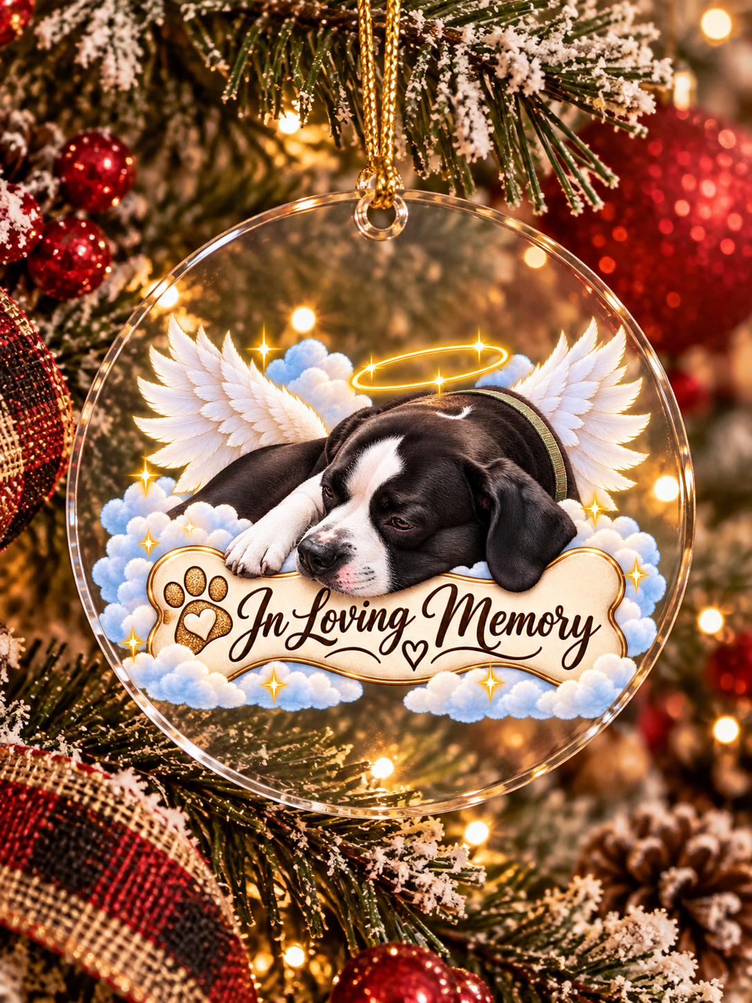 Black and white dog personalized acrylic memorial ornament hanging on a Christmas tree