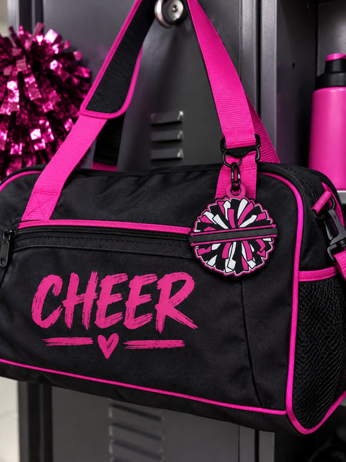 Pink black and white 3D printed cheer pom pom hair tie holder bag tag on a cheer bag