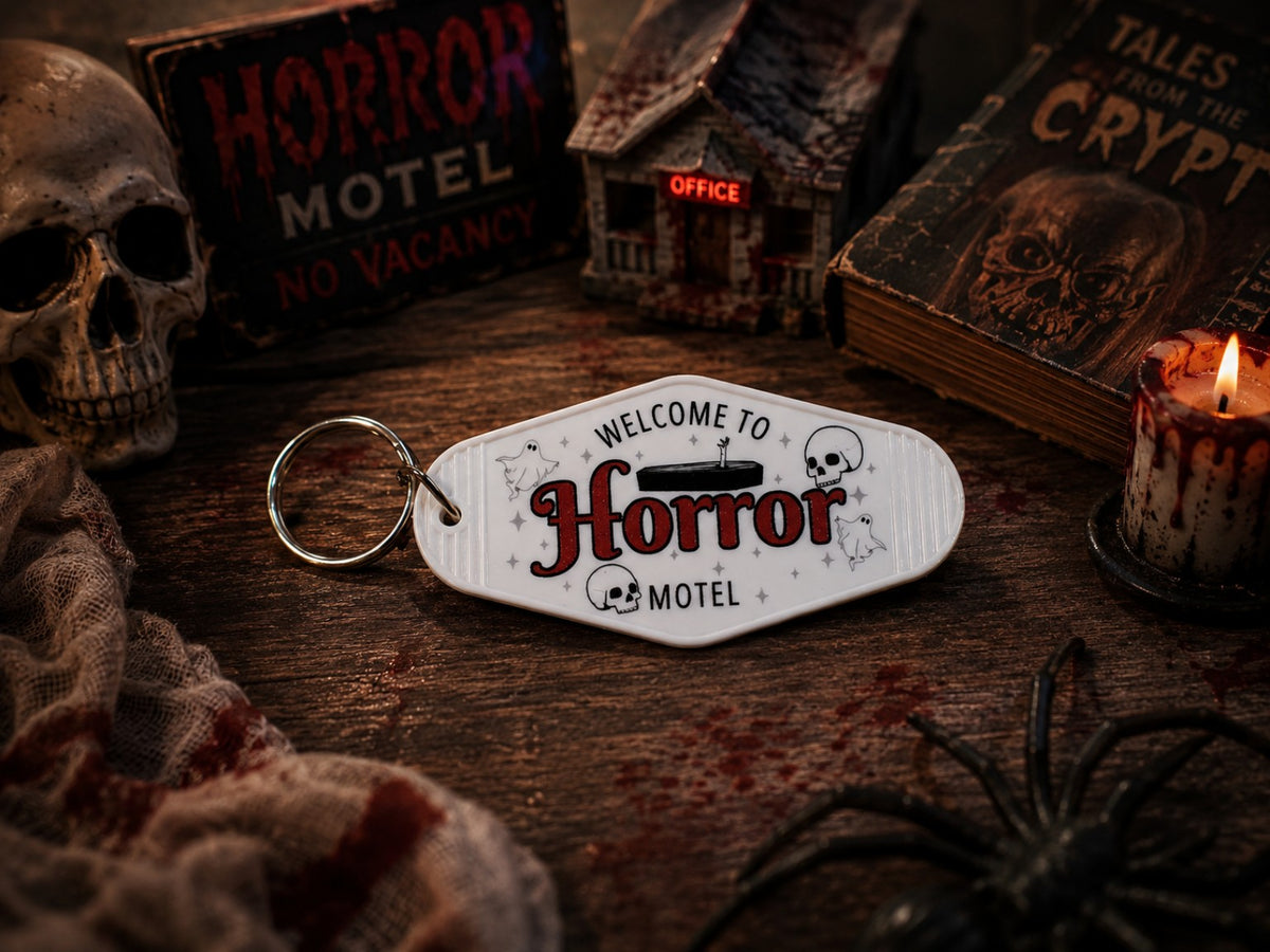 3D printed Welcome to Horror Motel book trope keychain