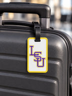 Purple and gold LSU letter design luggage tag on suitcase