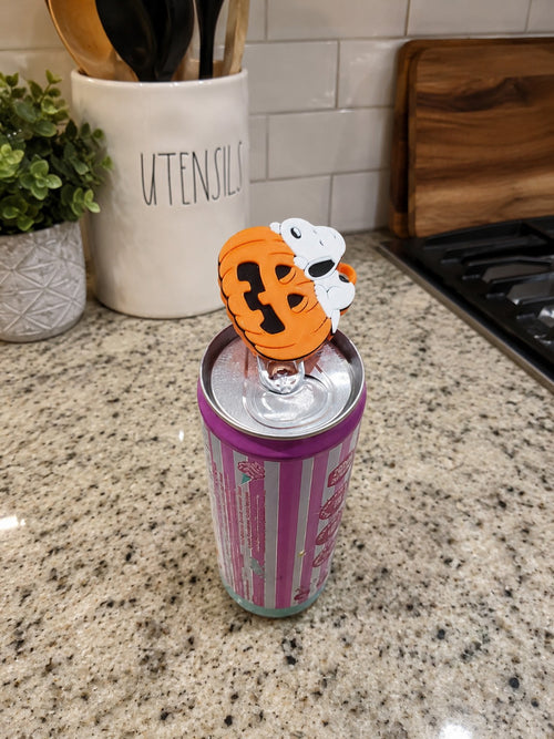 Orange and white 3D printed nail saver can opener on top of a beverage can