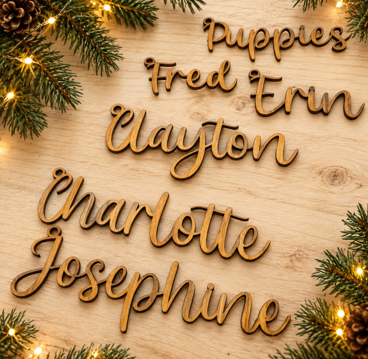 Personalized wooden script Christmas stocking name tags on festive wooden background